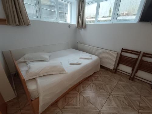Postel nebo postele na pokoji v ubytování Casa Rezidentiala Pasteur