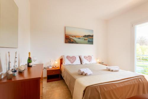 Ένα ή περισσότερα κρεβάτια σε δωμάτιο στο Libeccio Luxury Torre Lapillo