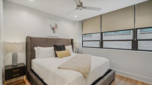 a bedroom with a bed and a ceiling fan at The Eleanor New Orleans in New Orleans