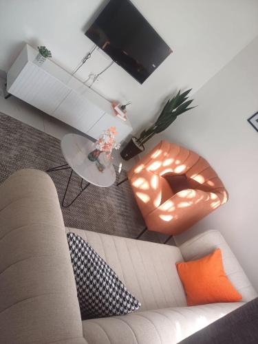 a living room with a couch and a table at Es Su Casa in Mombasa