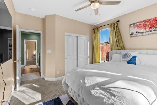 a bedroom with a bed and a ceiling fan at Game Lovers Retreat, spacious 4000 sqft Getaway in El Dorado Hills
