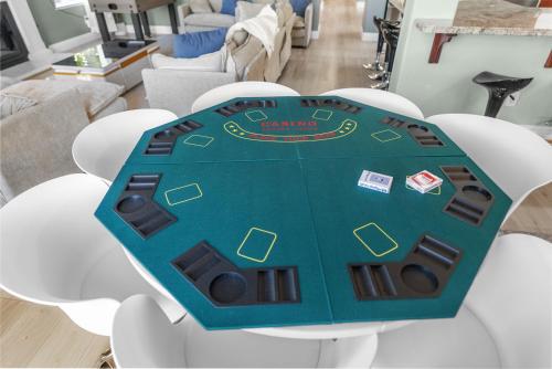 a cake on a table in a living room at Game Lovers Retreat, spacious 4000 sqft Getaway in El Dorado Hills