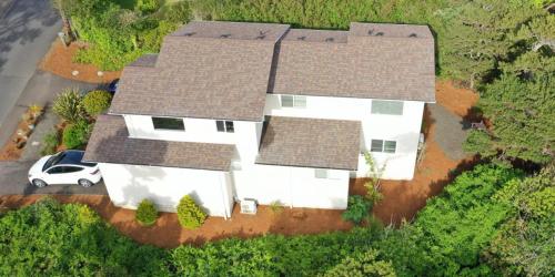an overhead view of a white house with a car at Pacific Peek One - OceanView - EV Charger - Pet OK in Wecoma Beach