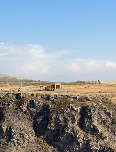 a house in the middle of a field at Denver Villa in Sagmosavan