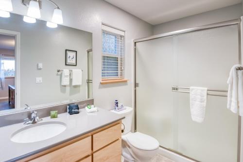 a bathroom with a sink and a toilet and a shower at Pacific Peek One - OceanView - EV Charger - Pet OK in Wecoma Beach