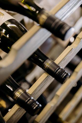 a bunch of wine bottles sitting on a rack at TÉGED VÁRTALaK in Dörgicse