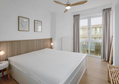 Ένα ή περισσότερα κρεβάτια σε δωμάτιο στο Les Voiliers 17