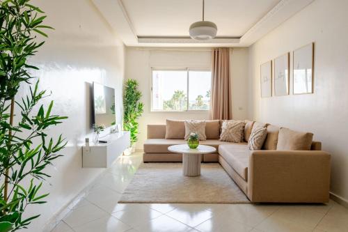 a living room with a couch and a table at Rabat Centro Apartments in Rabat