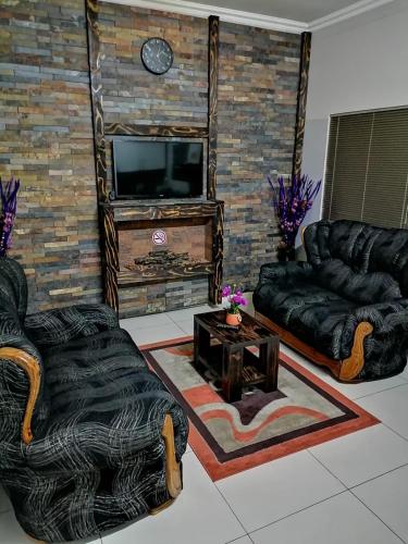 O zonă de relaxare la Cosy Urban Park Accommodation K005