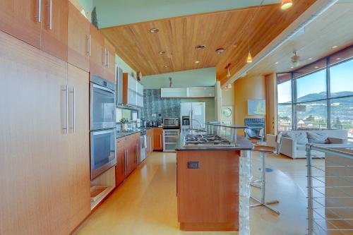 a large kitchen with orange cabinets and a counter top at Alizes 30 Day in Hood River