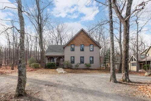 a large house with trees in front of it at Wintergreen Ridge Retreat - Family Home in Wintergreen