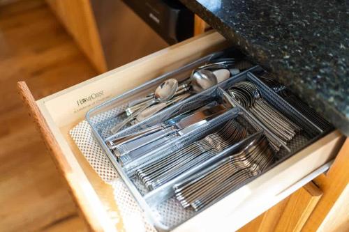 a drawer in a kitchen with utensils in it at Wintergreen Ridge Retreat - Family Home in Wintergreen