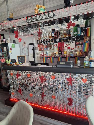 a bar with red hearts on the wall at The Garnett in Blackpool