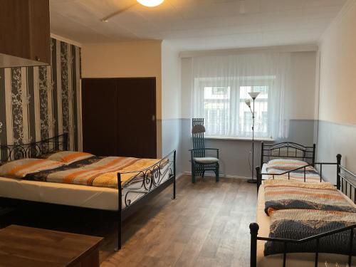 Postel nebo postele na pokoji v ubytování Pension&Hostel Anna - Monteurzimmer