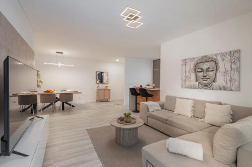 a living room with a couch and a table at Uptown II by An Island Apart in Funchal