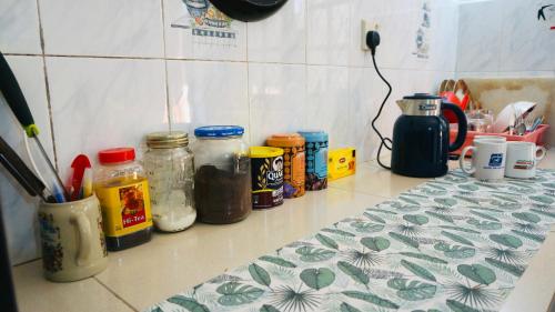 a kitchen counter with jars of condiments on it at House of Sincerity in Maharagama