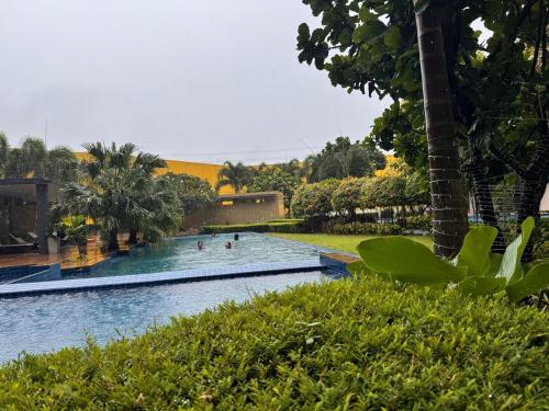 a swimming pool with people in the water at Mon Amour Haven in Taytay