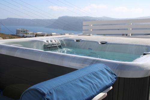 a jacuzzi tub on top of a building at Mary Castelia Villa with Jacuzzi in Akrotiri