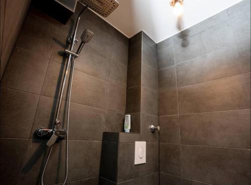 a bathroom with a shower with a shower head at Livemore24 - Apartment 2 in Oer-Erkenschwick WLAN in Oer-Erkenschwick