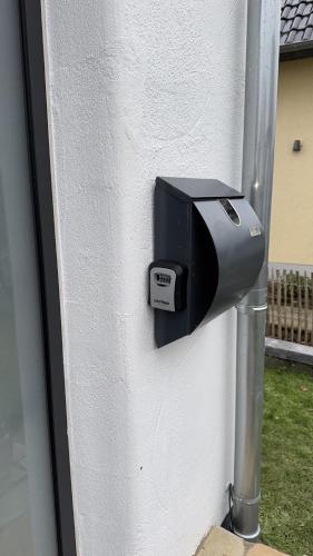 a mailbox on the side of a house at Ferienwohnung Weitblick in Erftstadt