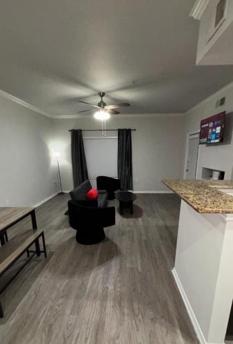 a living room with a couch and a table at Hill Country Hilltop Haven in Bee Cave