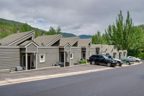 a row of houses with cars parked in front of them at Chillside Chalet Modern West Vail Townhouse! in Vail