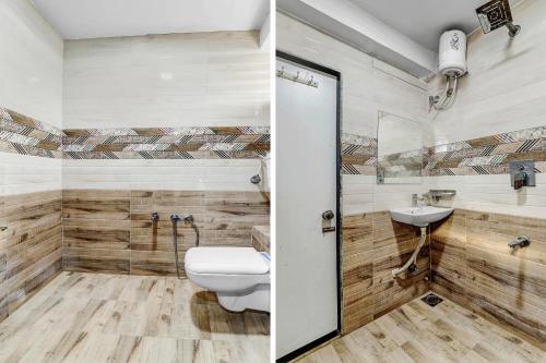 a bathroom with a toilet and a sink at Hotel O Maple view in Naroda