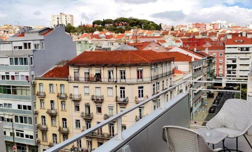 a view of a city from the balcony of a building at Lisbon City Inn Hotel by City Hotels in Lisbon