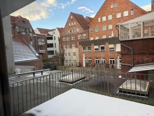 a view from a window of a courtyard with buildings at Between I in Lübeck