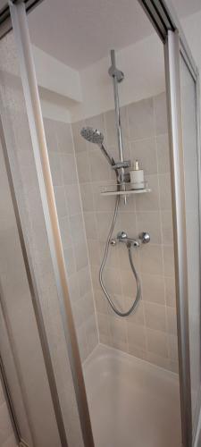 a shower in a bathroom with a shower at Ankerplatz in Travemünde