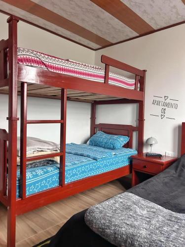 Postel nebo postele na pokoji v ubytování Hostal 7 colores