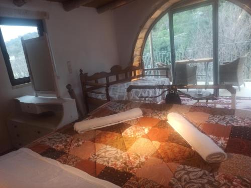 Ένα ή περισσότερα κρεβάτια σε δωμάτιο στο Kourtsa villas