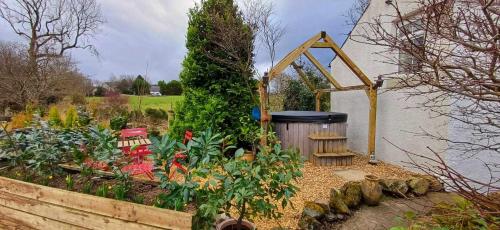 Jardin de l'établissement Riverside Cottage at Logwood Mill