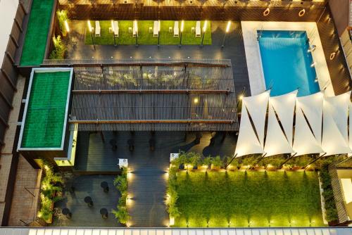 an aerial view of a building with a swimming pool at Sercotel Alcalá 611 in Madrid