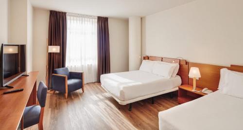 Posteľ alebo postele v izbe v ubytovaní Sercotel Arrahona Sabadell