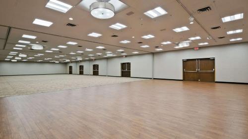 a large ballroom with a wooden floor and white walls at Best Western Ramkota Hotel Aberdeen in Aberdeen