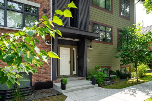 a brick house with a white door at Your Downtown Urban Sanctuary - Walk to EVERYTHING in Bozeman