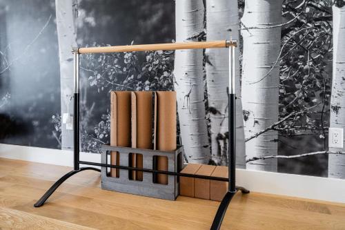 a book stand with books in front of a wall at Your Downtown Urban Sanctuary - Walk to EVERYTHING in Bozeman