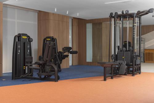 a gym with treadmills and exercise equipment in a room at Radisson Riviera Panama in Punta Chame