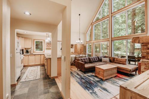 a large living room with a couch and a kitchen at Mt Baker Lodging Cabin 40GS is a Classic NW cabin in Deming