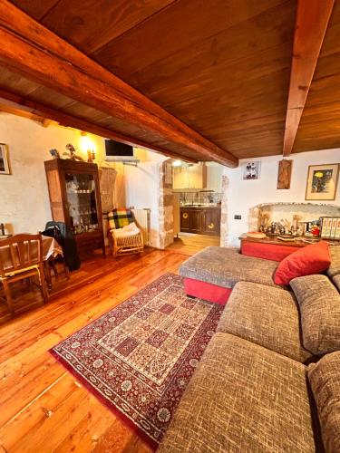 a living room with a couch and a table at Rifugio di Nonno Gabriele in Santo Stefano di Sessanio