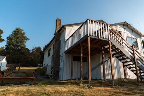 a house with a staircase on the side of it at Maydena Chalet in Maydena