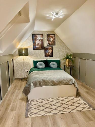 a bedroom with a bed and a ceiling at Country Haven Comfy & Sleek Apartment in Kildare