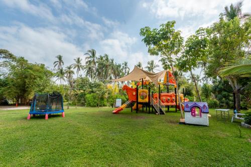 a group of playground equipment in a park at Rojo Manglar Acapulco in Acapulco