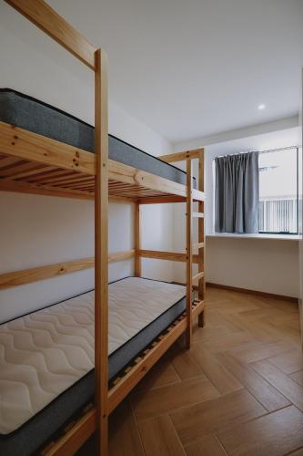 Postel nebo postele na pokoji v ubytování 888 Hostel&Suites