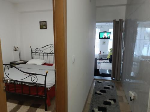 a bedroom with a bed and a tv in a room at Mountain Relax Vlašić in Vlasic
