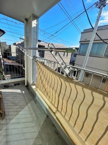 a balcony with a railing on a house at Chill Fortuna Shimokitazawa Tokyo in Tokyo
