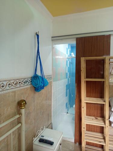 a bathroom with a shower and a toilet and a shower at Entre a paz e o canto dos pássaros in Manaus