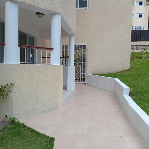 a walkway outside of a building with a gate at Gorgeous 1 Bedroom Apartment in the Kingston Hills in Kingston