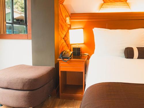 Postel nebo postele na pokoji v ubytování Hotel Ferré Machu Picchu
